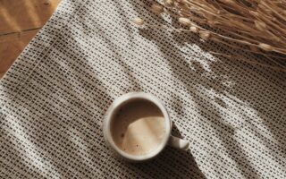 coffee cup and flowers near