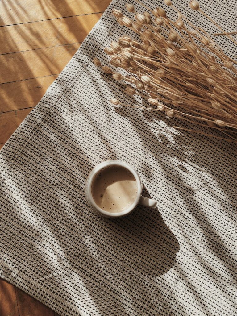 coffee cup and flowers near