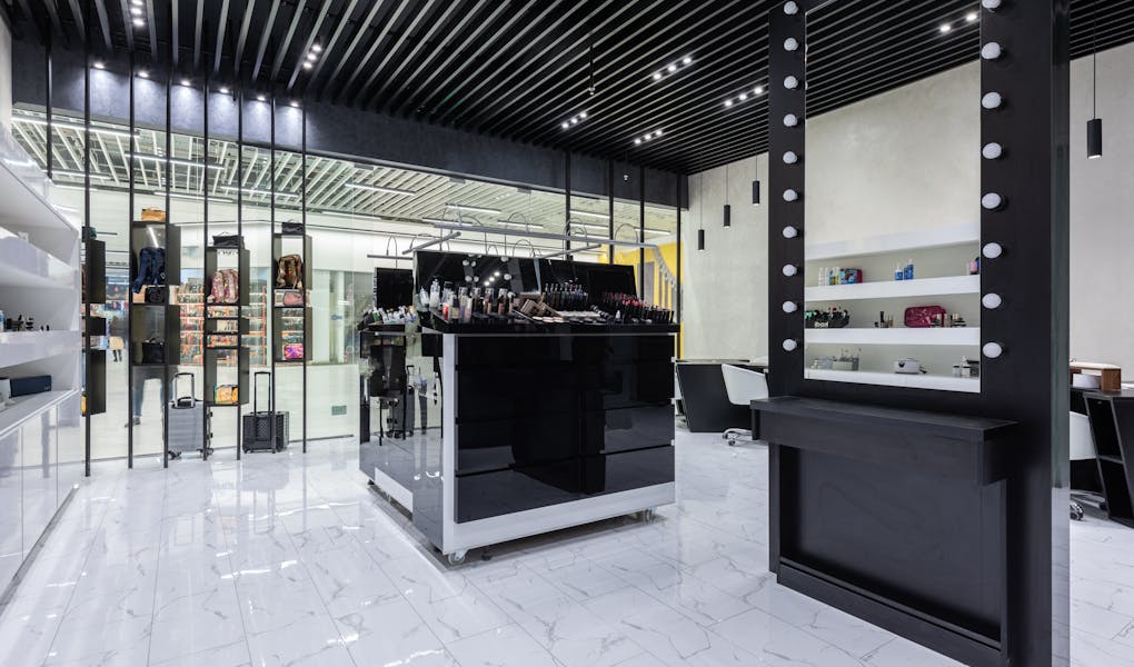 Sleek modern interior of a beauty store with cosmetics and chic decor.