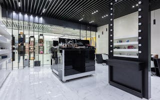 Sleek modern interior of a beauty store with cosmetics and chic decor.