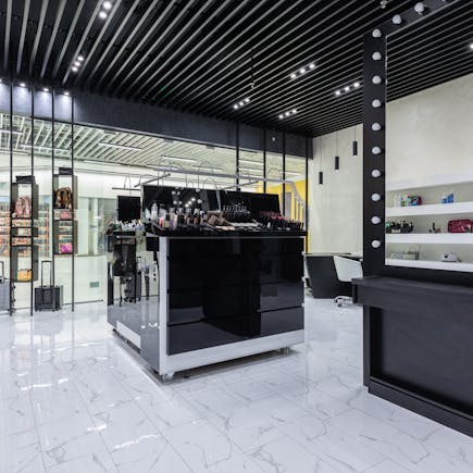 Sleek modern interior of a beauty store with cosmetics and chic decor.