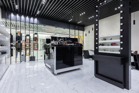 Sleek modern interior of a beauty store with cosmetics and chic decor.